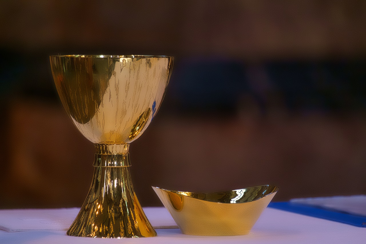 Gold chalice and salver on table