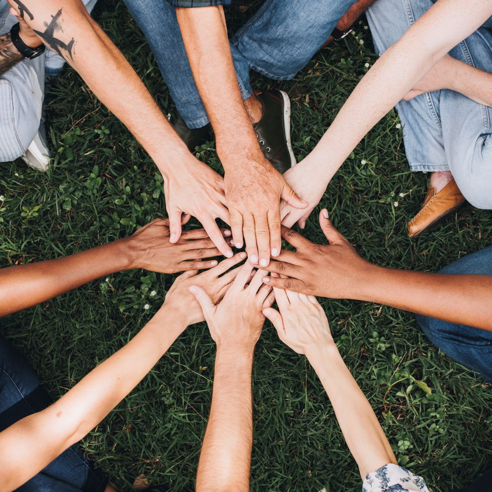 People stacking hands together